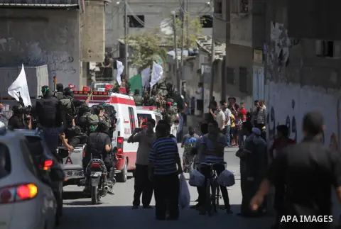 Palestinian militants take part in a protest against peace talks between Israel and the Palestinians, as well as possible U.S. attacks on Syria, in the northern Gaza Strip September 6, 2013. The protest was organized by...