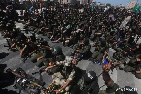 Palestinian militants perform Friday prayers at a street during a protest against peace talks between Israel and the Palestinians, as well as possible U.S. attacks on Syria, in the northern Gaza Strip September 6, 2013....