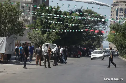Palestinians wait to ride a taxi at street in Gaza City, 08 Sep, 2013. A fuel crisis continues in the Gaza Strip, which began at the beginning of July, Egyptian troops have stepped up their crackdown on the smuggling tun...