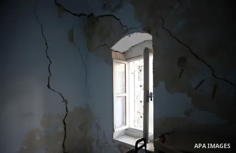 Cracks on a wall of a Palestinian home are seen in the al-Qirami quarter in the old town of Jerusalem, Sept. 11, 2013. Landslides occurred Wednesday due to the network of tunnels that Jerusalem's municipality is digging...
