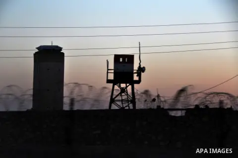 An Egyptian soldier stands guard on the border between Egypt and Gaza Strip, in Rafah town southern Gaza Strip, on September 13, 2013. Egyptian security forces have stepped up a crackdown campaign on smuggling tunnels be...