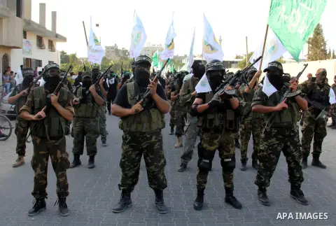 Palestinian Hamas militants take part in a protest against peace talks between Israel and the Palestinians, in Gaza City September 14, 2013. . Photo by Ezz Zanoun