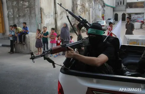 Palestinian Hamas militants take part in a protest against peace talks between Israel and the Palestinians, in Gaza City September 14, 2013. . Photo by Ezz Zanoun