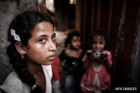 Palestinian girls play outside their family's home in a poverty-stricken quarter of al-Zaytoon in Gaza City on Sept. 17, 2013. Reports said that an increasing number of Gaza families are reportedly falling further into p...