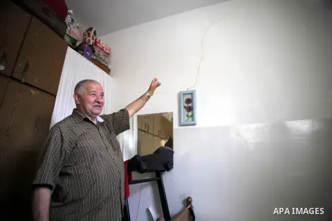 A Palestinian man gestures to a cracked wall in his home in Jerusalem's old City on Sept. 19, 2013. Israeli authorities issued evacuation orders to 20 Palestinian families in the al-Qarmi neighborhood of of Jerusalem's O...