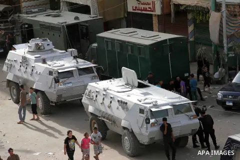 Egyptian security forces stand guard at the entrance to Kerdasa, a town 14 km (9 miles) from Cairo September 19, 2013, as Egyptian security forces clashed with gunmen on the outskirts of the capital. Egyptian security fo...