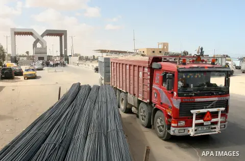 A Palestinian truck carries cement supplies after upon arrival to the town of Rafah through the Kerem Shalom crossing between Israel and the southern Gaza September 22, 2013. Israel began allowing construction material f...