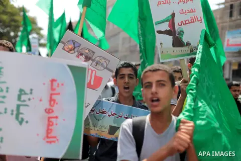 Palestinians shout slogans during a protest organised by the Hamas movement in Gaza City on September 24, 2013, amid recent tensions among Palestinians regarding Israel's admittance of visitors to a holy site in Jerusale...