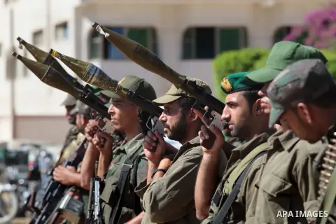 Members of Hamas' Palestinian National Security forces stand at attention during a military parade on the streets of Gaza City, Wednesday, Sept. 25, 2013. Egypt's Foreign Minister Nabil Fahmy has warned Hamas of a "harsh...