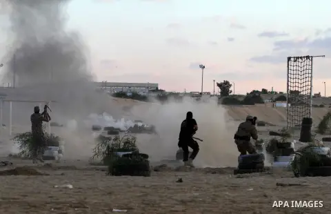 Palestinian militants from Al Nasser Brigades, an armed wing of the Popular Resistance Committees (PRC), take part in a training session in Khan Younis, southern Gaza Strip, Friday, Sept. 27, 2013. Photo by Ashraf Amra