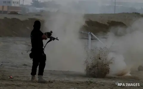 Palestinian militants from Al Nasser Brigades, an armed wing of the Popular Resistance Committees (PRC), take part in a training session in Khan Younis, southern Gaza Strip, Friday, Sept. 27, 2013. Photo by Ashraf Amra