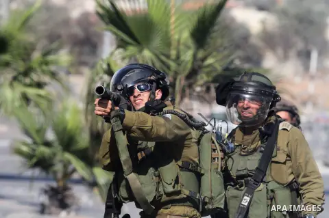Israeli soldiers rubber at Palestinian protesters during clashes in al-Ram village in north of Jerusalem city on September 27, 2013. Thousands of Palestinians demonstrated in the Gaza Strip, the West Bank and east Jerusa...