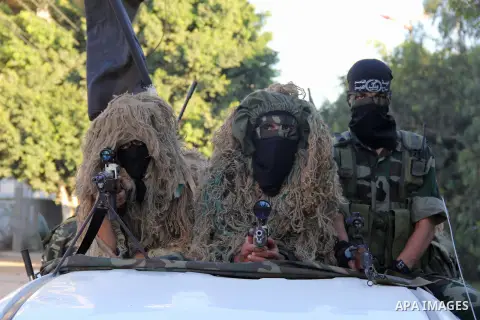 Palestinian militants from Al Nasser Brigades, an armed wing of the Popular Resistance Committees (PRC), take part in a training session in Gaza City, Sept. 28, 2013. Photo by Mosad al-Mahmuom