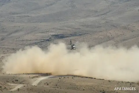 An Israeli military helicopter flies over the Massafer Yatta area, near the West Bank City of Hebron, on 01 October 2013. According to reports, Palestinian citizens in the area south of Yatta must leave while Israeli gov...