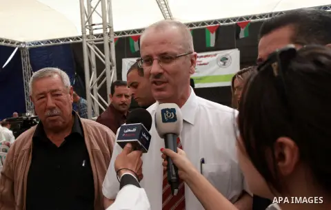 Palestinian Prime Minister Rami Hamdallah attends the 8th Annual Bilin Conference on the Palestinian Popular Struggle in Bilin, West Bank, 02 October 2013. The annual conference has become a platform for debate by the po...