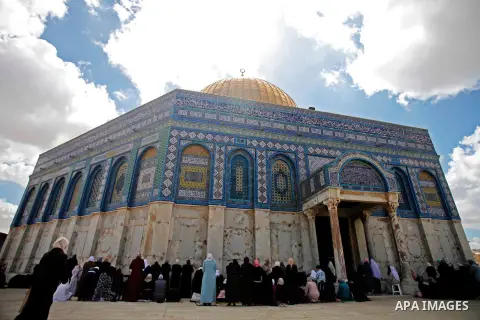Palestinian worshipers pray outside the Dome of the Rock mosque at the Al-Aqsa compound, Islam s third holiest site, in the old city of Jerusalem, on October 4, 2013. Photo by Saeed Qaq