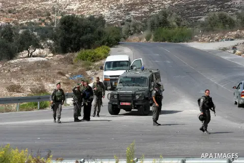 Israeli soldiers patrol streets near the village of Burqa, north of Nablus, the West Bank on Saturday, Oct. 05, 2013. following the wounding two Israeli border guards by Palestinian driver. Locals say dozens of Israeli s...