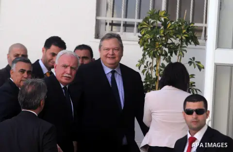 Palestinian Foreign Minister Riyad al-Malki receives his counterpart, Greek Foreign Minister Evangelos Venizelos, in the West Bank city of Ramallah on October 9, 2013, prior to an official visit with Palestinian presiden...