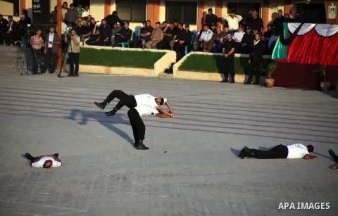 Palestinian policemen show their skills during a graduation ceremony in Gaza City on October 13, 2013. Photo by Ashraf Amra