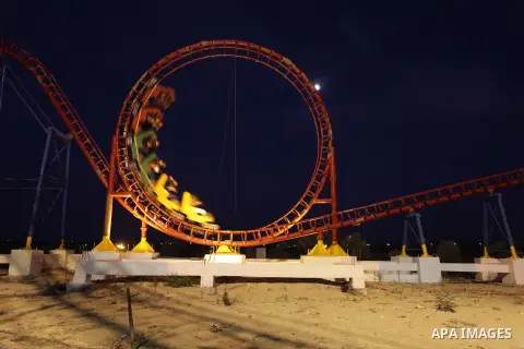 Palestinian children play at an amusement park during the second day of Eid al-Adha or "Feast of the sacrifice" in Gaza City on October 16, 2013. Muslims across the world are celebrating the annual festival of Eid al-Adh...