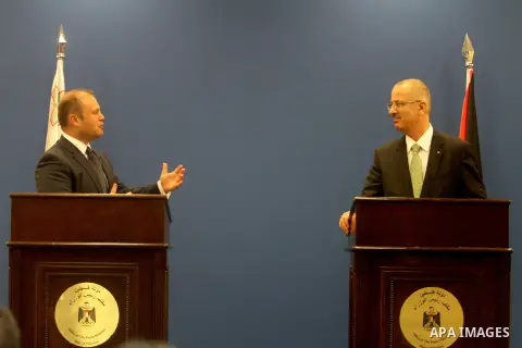 Palestinian Prime Minister Rami Hamdallah meets with his Maltese counterpart Joseph Muscat, during his visit to the West Bank city of Ramallah, 17 October 2013. The Maltese premier is on a regional tour starts from Libya...