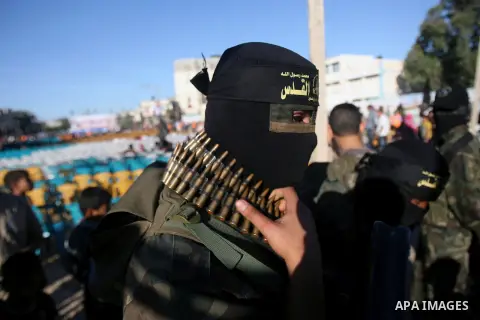 A Palestinian militant of Jihad Islamic movement takes part in a rally marking the 18th anniversary of the killing of Fathi al-Shiqaqi, the movement's founder, in Rafah in the southern Gaza Strip Oct. 24, 2013. al-Shiqaq...