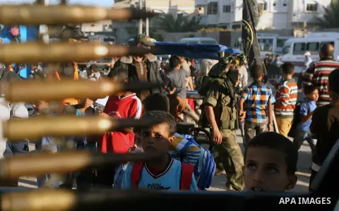 Palestinian supporters of Islamic Jihad movement attend a rally marking the 18th anniversary of the killing of Fathi al-Shiqaqi, the movement's founder, in Rafah in the southern Gaza Strip Oct. 24, 2013. al-Shiqaqi was s...