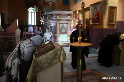Russian tourists pray at the Russian Compound Church "al-Muskubīya" , in the West Bank city of Hebron, on Oct. 26, 2013. The site of the oak was acquired in 1868 by Archimandrite Antonin (Kapustin) for the Church of Russ...