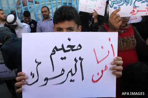Syrian and Palestinian-Syrian refugees take part in a protest in front of the headquarters United Nations Relief and Works Agency (UNRWA) to demand assistance and work in Gaza city, on Oct. 28, 2013. Photo by Mohammed As...