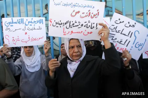 Syrian and Palestinian-Syrian refugees take part in a protest in front of the headquarters United Nations Relief and Works Agency (UNRWA) to demand assistance and work in Gaza city, on Oct. 28, 2013. Photo by Mohammed As...