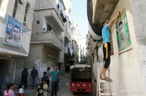 Relatives of Palestinian prisoner Hazem Shubair, who has been held by Israel since 1994, decorate his home after hearing news on his expected release, in Khan Younis in the southern Gaza Strip October 28, 2013. Israelis...