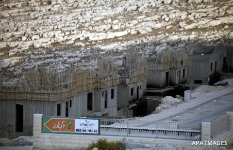 A construction site is seen in Pisgat Zeev, an urban settlement in an area Israel annexed to Jerusalem after the 1967 Middle East war, near the Arab village of Beit Hanina, North Jerusalem, October 29, 2013. The PLO deni...