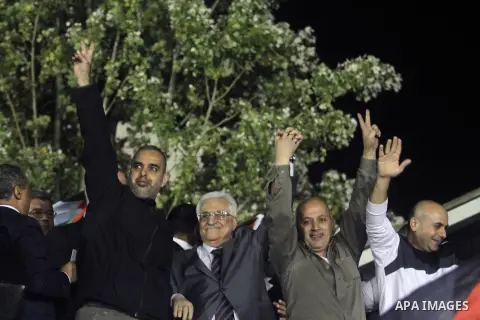 Palestinian President Mahmoud Abbas welcomes Palestinian prisoners released from Israeli prisons in the West Bank city of Ramallah early October 30, 2013. Israel freed 26 Palestinian prisoners on Wednesday, the second st...