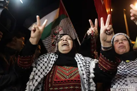 Palestinian prisoners' relatives wait for their release at Erez crossing in the northern Gaza Strip on October 29, 2013. Israel was preparing on October 29, 2013 to release 26 long-serving Palestinian prisoners, the seco...