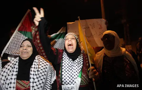 Palestinian prisoners' relatives wait for their release at Erez crossing in the northern Gaza Strip on October 29, 2013. Israel was preparing on October 29, 2013 to release 26 long-serving Palestinian prisoners, the seco...