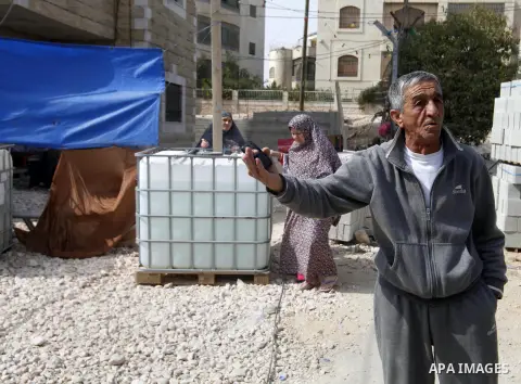 A Palestinian man stands on the rubble after Israeli forces destroyed their family house in the East Jerusalem neighbourhood of Beit Hanina, which falls in the West Bank side of Israel's separation barrier on Oct. 30, 20...