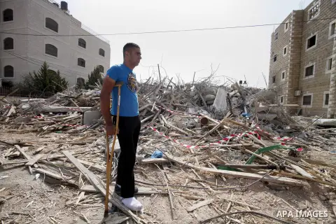 A Palestinian man stands on the rubble after Israeli forces destroyed their family house in the East Jerusalem neighbourhood of Beit Hanina, which falls in the West Bank side of Israel's separation barrier on Oct. 30, 20...