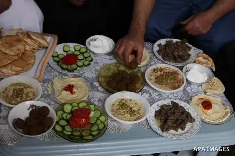 Freed Palestinian prisoner Ahmed al-Damoni, who was held by Israel for 23 years, eats breakfast inside his family's house in the central Gaza Strip October 30, 2013. Israelis say al-Damoni was convicted of killing an Isr...