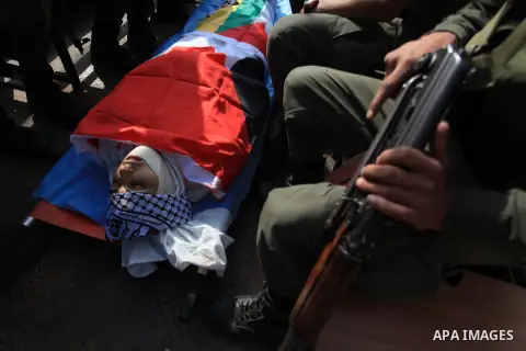 Palestinian policemen funeral the body of Ahmed Imad Yusef in the West Bank village of Qabatiya, near Jenin October 31, 2013. Israeli troops shot dead Yusef, a Palestinian, during a clash in the occupied West Bank on Thu...