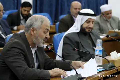 Members of the Palestinian Legislative Council, attend the meeting at the Legislative Council, in Gaza City on Oct. 31, 2013, to mark the 96 anniversary of the Balfour Declaration. Photo by Mohammed Asad