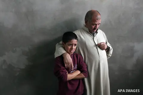 The father and brother of Palestinian hamas militant Rabee Baraka habe a farewell look at his body in a hospital in Khan Younis in the southern Gaza Strip November 1, 2013. The local commanders of Hamas's military wing w...