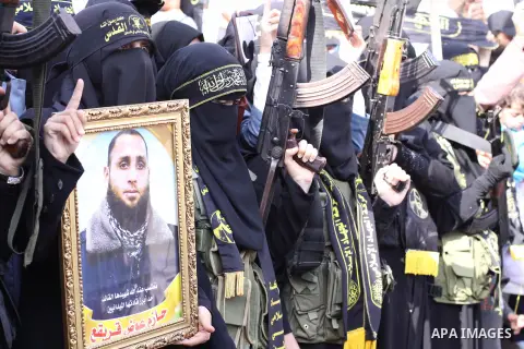 Palestinian female militants of the Islamic Jihad hold their weapons during a rally marking the 26th anniversary of the movement's foundation and marking the 18th anniversary of the death of the group's leader Fathi Shik...