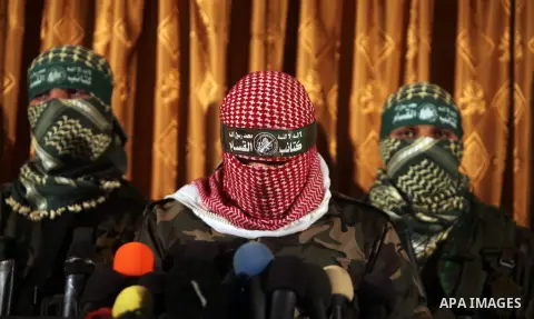 Spokesman of al-Qassam Brigade, the military wing of Hamas movement, Abu Obeida, holds a press conference in Gaza City on November 01, 2013. Abu Obeida said that the Qassam Brigades will respond to any Israeli attack on...