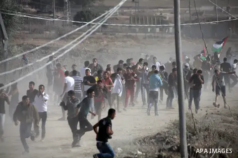 Palestinian protestors clash with Israeli security forces following a protest at the Nahal Oz border crossing with Israel, east of Gaza City, on November 1, 2013. Israeli troops on Friday clashed with Palestinians during...