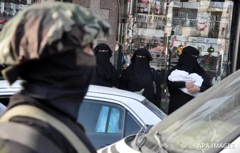 Members of al-Quds brigades, the military wing of Jihad Islamic organisation march along the streets in Gaza City on November 13, 2013, ahead of the first anniversary an Israeli army operation which was launched after th...
