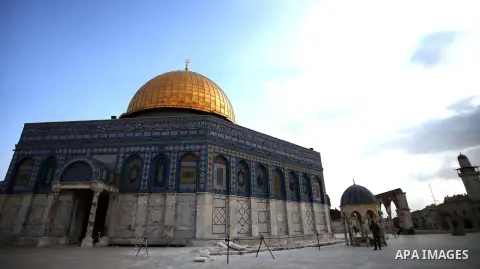 A Palestinian man stands next to a ditch during a restoration work in front of the Dome of the Rock mosque at the al-Aqsa compound, in Jerusalem's old city on November 13, 2013. Restoration works started at al-Aqsa compo...