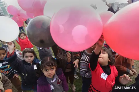 Palestinians hold balloons in the colour of the national flag to mark the 25th anniversary of the Palestinian Independence Day, in Gaza city, on Nov. 17, 2013. Palestinians have marked Nov. 15 as their Independence Day s...