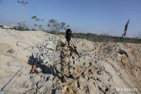 A Palestinian Islamic Jihad (PIJ) militant inspects a training camp which witnesses said was targeted in an overnight Israeli air strike in Beit Lahiya in the northern Gaza Strip November 20, 2013. Photo by Ashraf Amra