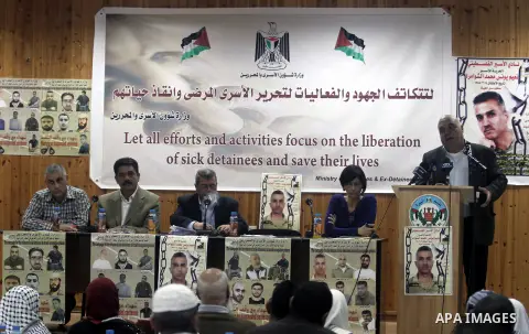 Palestinian relatives of prisoners in Israeli jails attend a press conference discusses the situation of sick prisoners calling for their release and save their lives, in the West Bank City of Ramallah, November 21, 2013...