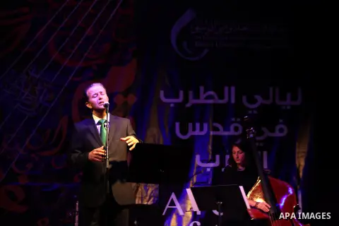 Jordanian singer Ayman Yahya sings during the concert of the week before last of "Music nights in Jerusalem of Arab" festival, in Jerusalem on November 21, 2013. The festival organised by Edward Said music conservatory f...